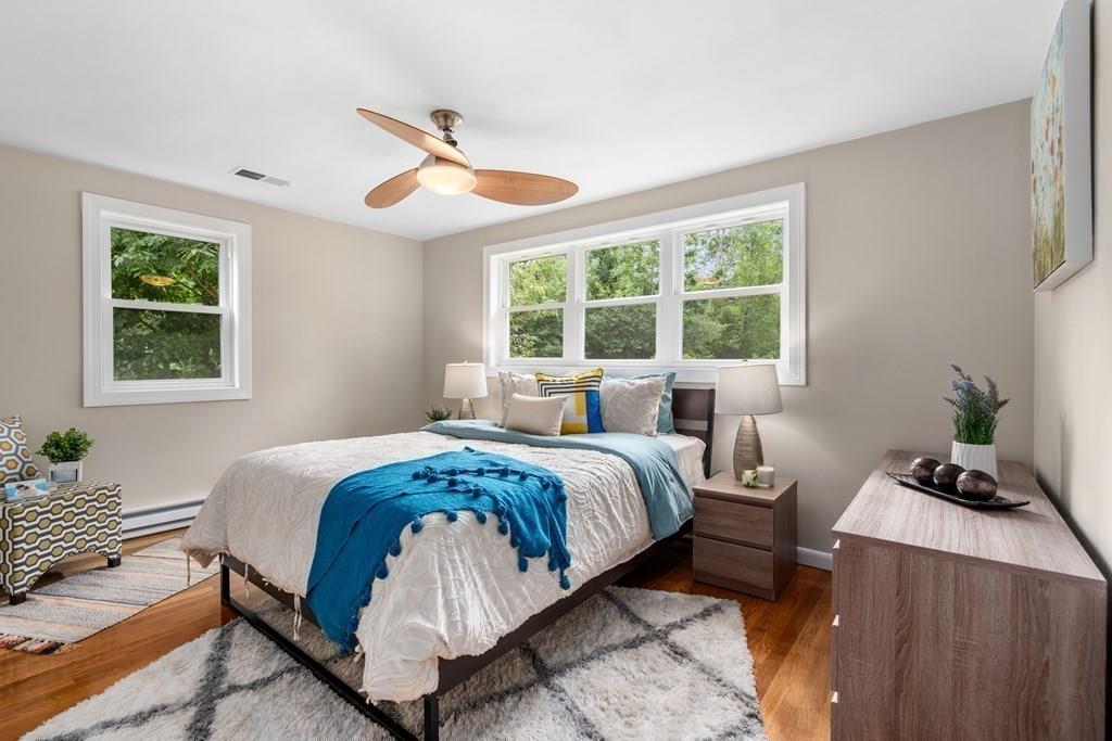 15 Pecunit Street Canton, MA 02021 - Photo 12 of 22 a spacious bedroom with a bed and a window