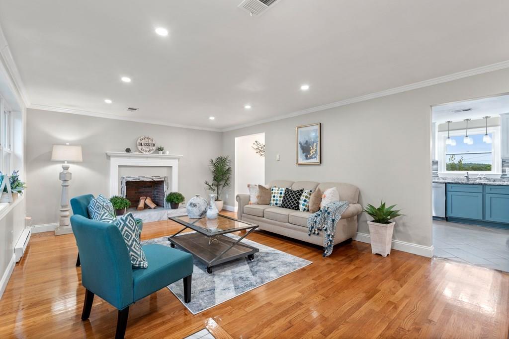 15 Pecunit Street Canton, MA 02021 - Photo 2 of 22 a living room with fireplace furniture and a fireplace