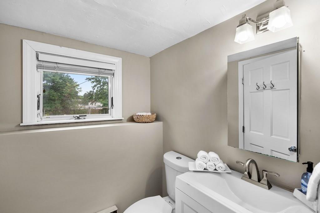 15 Pecunit Street Canton, MA 02021 - Photo 21 of 22 a bathroom with a sink mirror and toilet