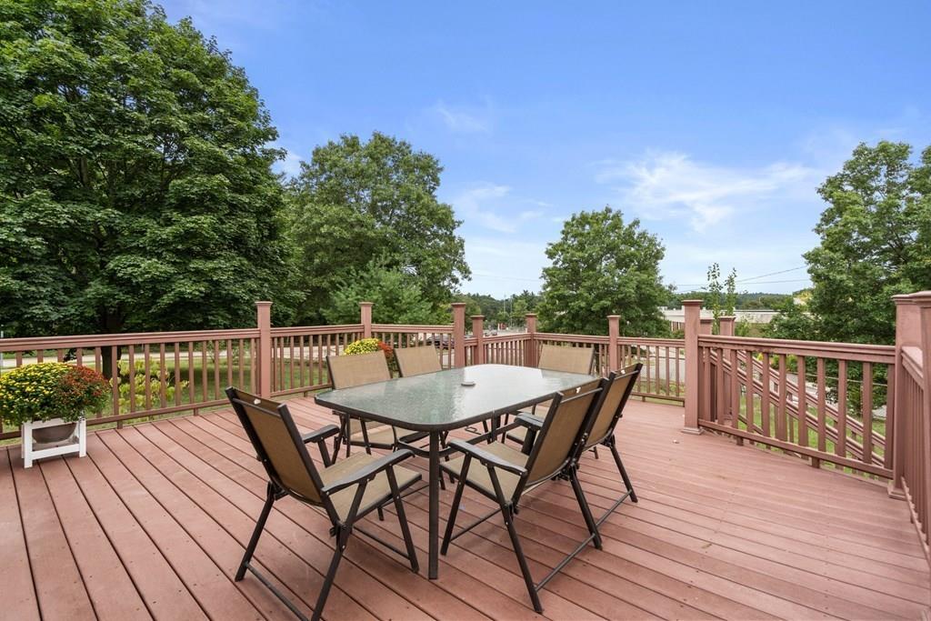 15 Pecunit Street Canton, MA 02021 - Photo 8 of 22 a view of a roof deck with table and chairs