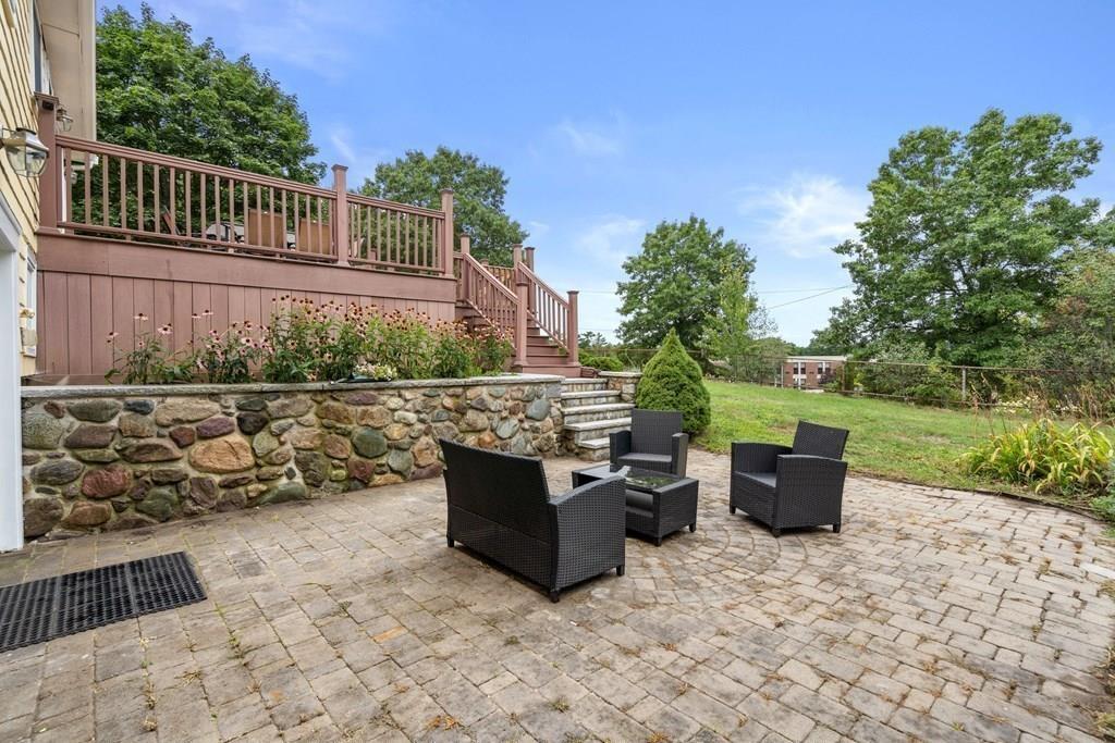 15 Pecunit Street Canton, MA 02021 - Photo 9 of 22 a view of a terrace with a garden