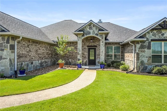 front view of a house with a yard