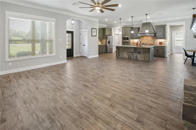 an open kitchen with dishwasher and white cabinets