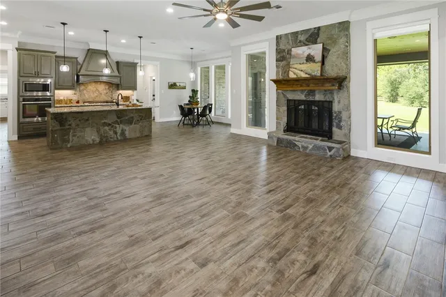 a living room with furniture fireplace and window