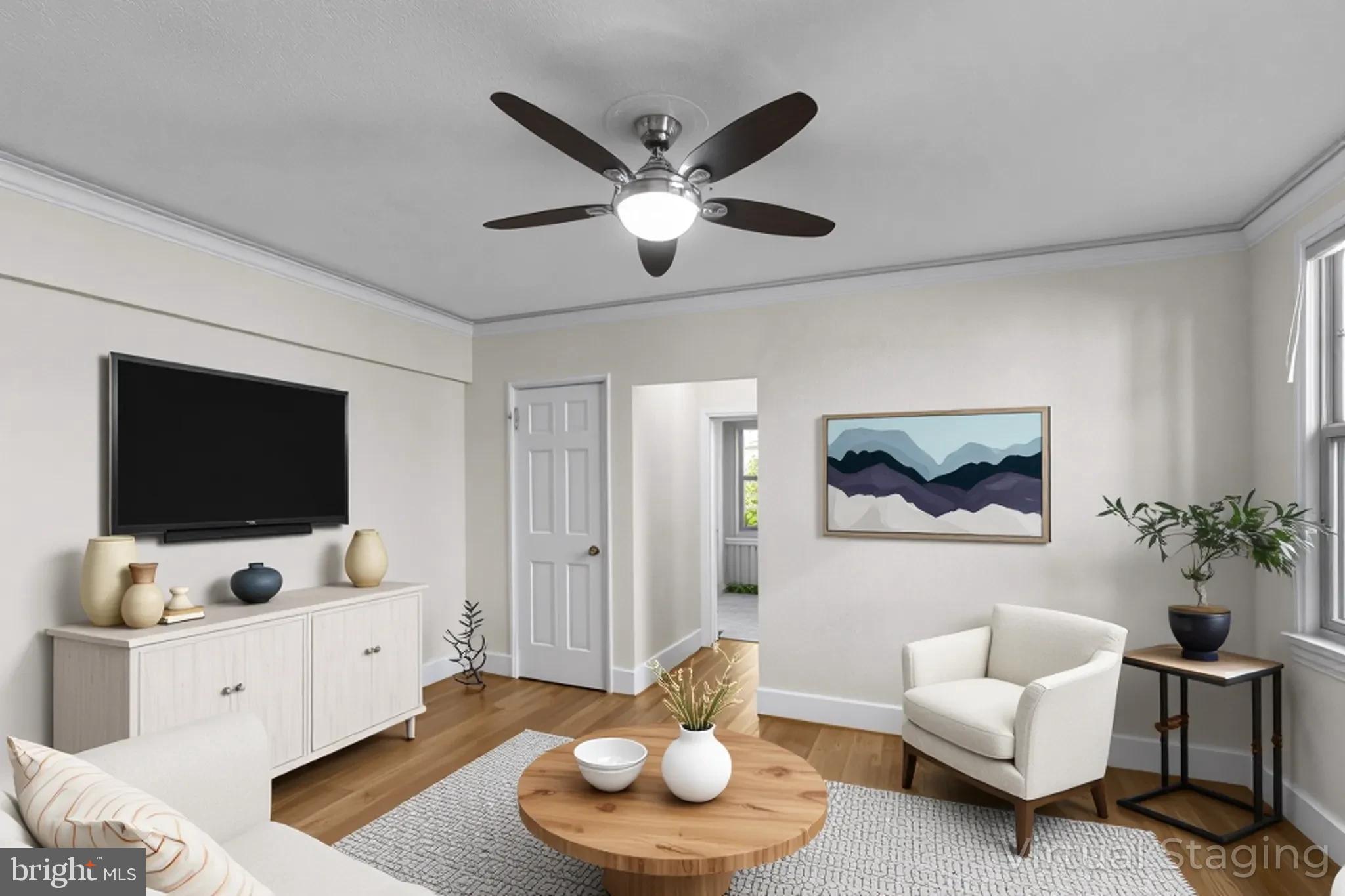 a living room with furniture and a flat screen tv