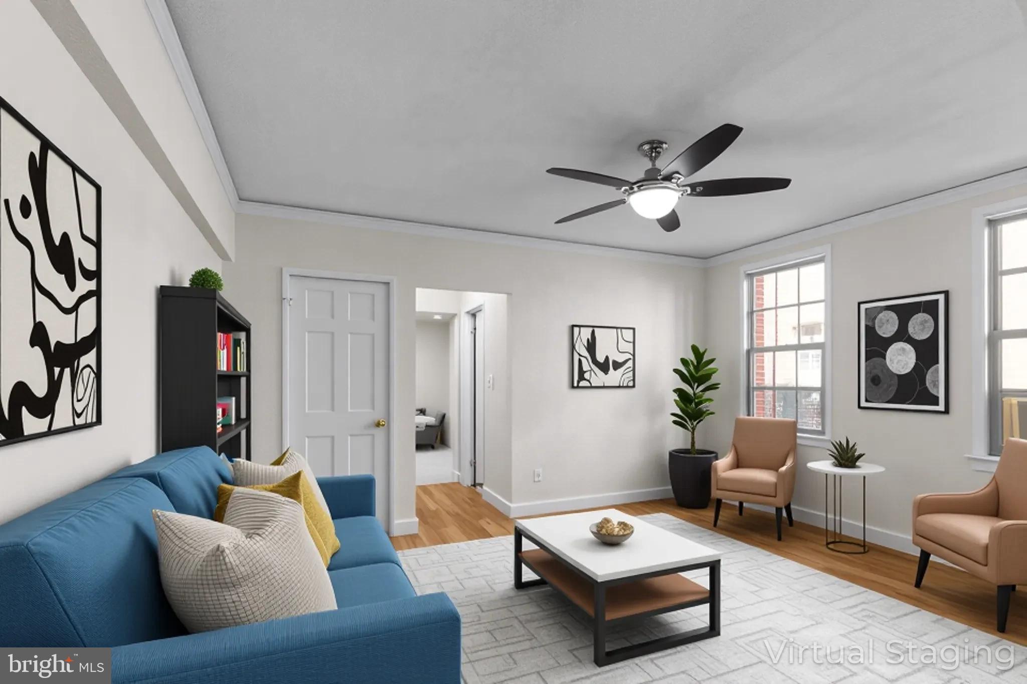 1441 Euclid Street Northwest, Unit 207 Washington, DC 20009 - Photo 16 of 23 a living room with furniture and a potted plant
