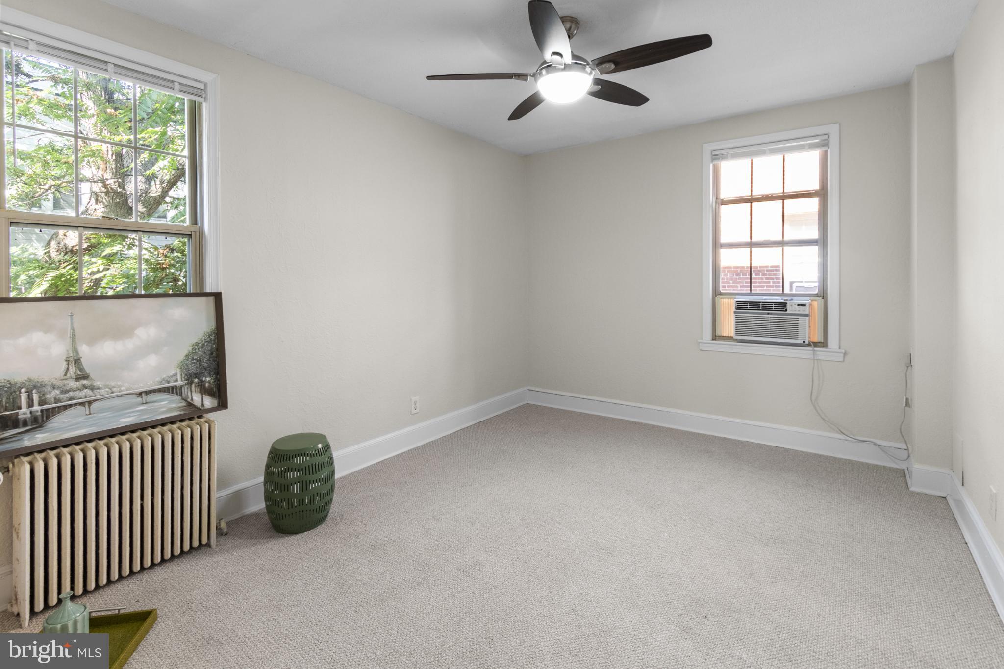 1441 Euclid Street Northwest, Unit 207 Washington, DC 20009 - Photo 19 of 23 an empty room with a window