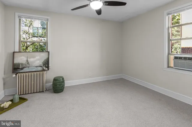 a view of livingroom with hardwood floor and a ceiling fan