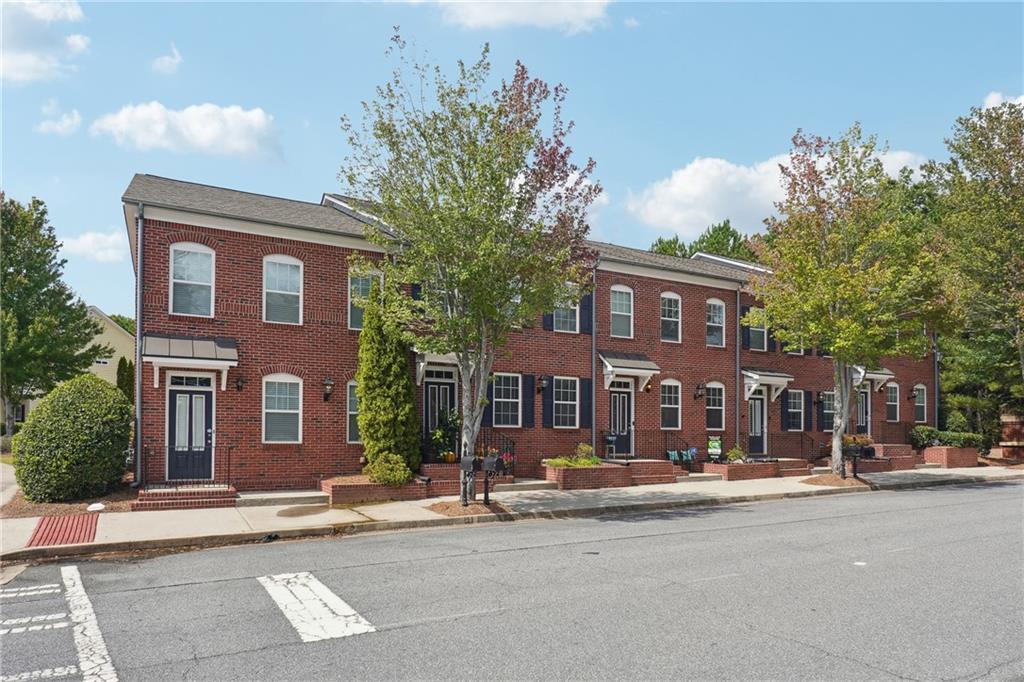 4126 Stonecypher Road Suwanee, GA 30024 - Photo 1 of 1 a front view of a building with street view