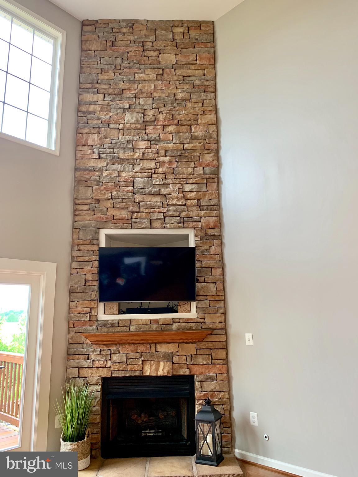 226 West Ridge Court Warrenton, VA 20186 - Photo 9 of 43 Gas fireplace w/stone wall to ceiling