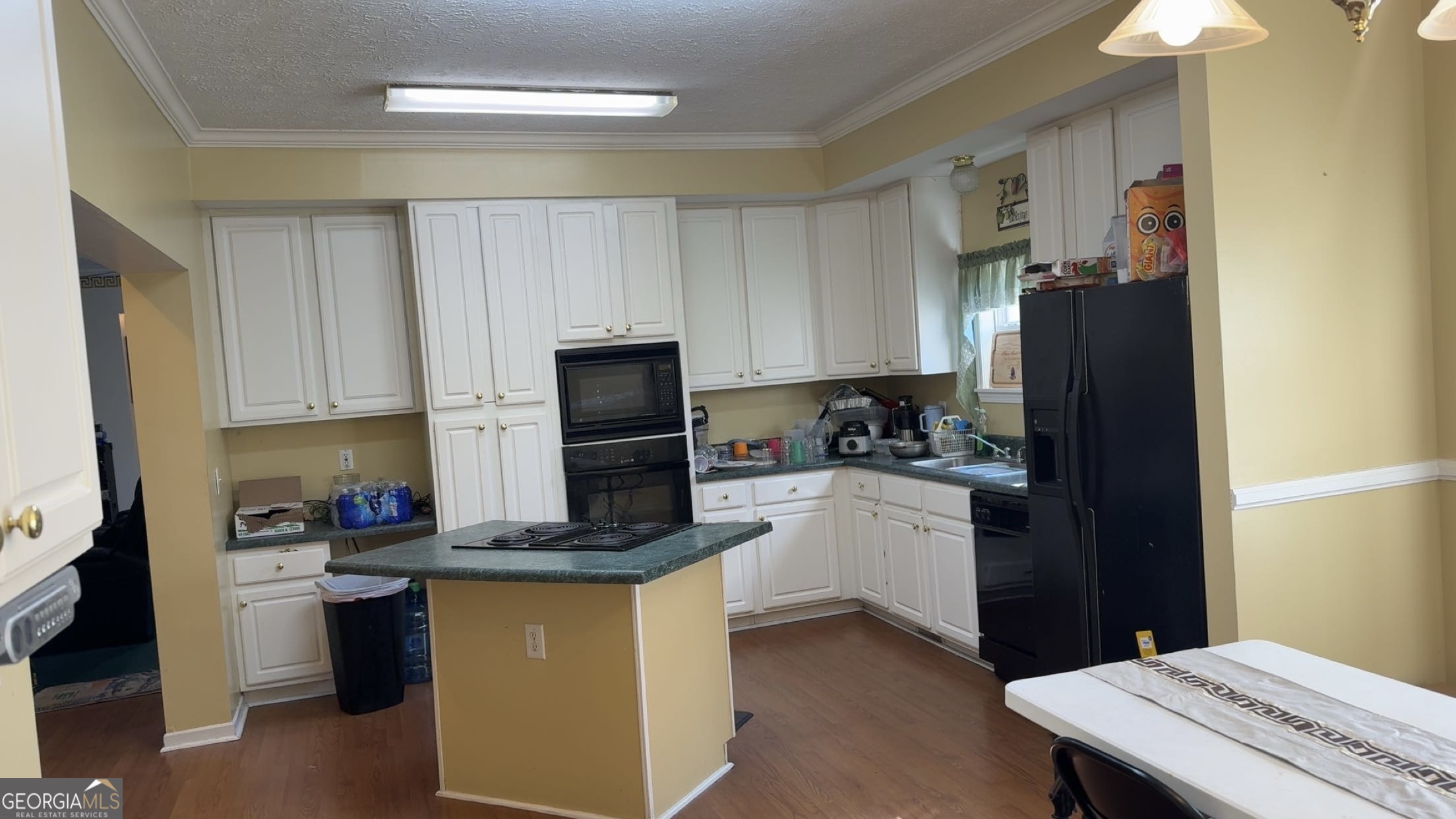 621 Highway 22 Sparta, GA 31087 - Photo 20 of 36 a kitchen with a refrigerator and a stove top oven