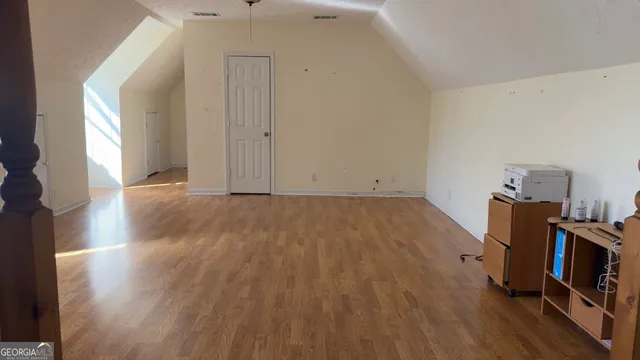 a room with a sink vanity and mirror
