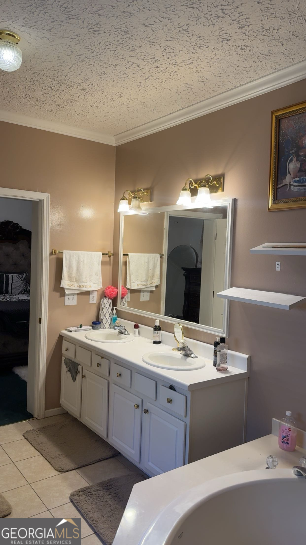 621 Highway 22 Sparta, GA 31087 - Photo 29 of 36 a room with a sink vanity and mirror