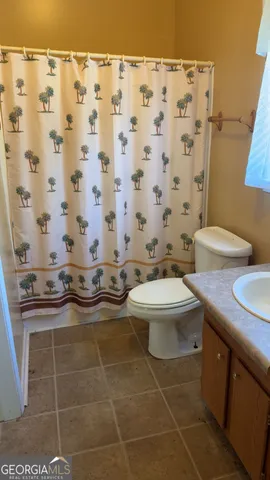 a view of a kitchen with a sink and cabinets
