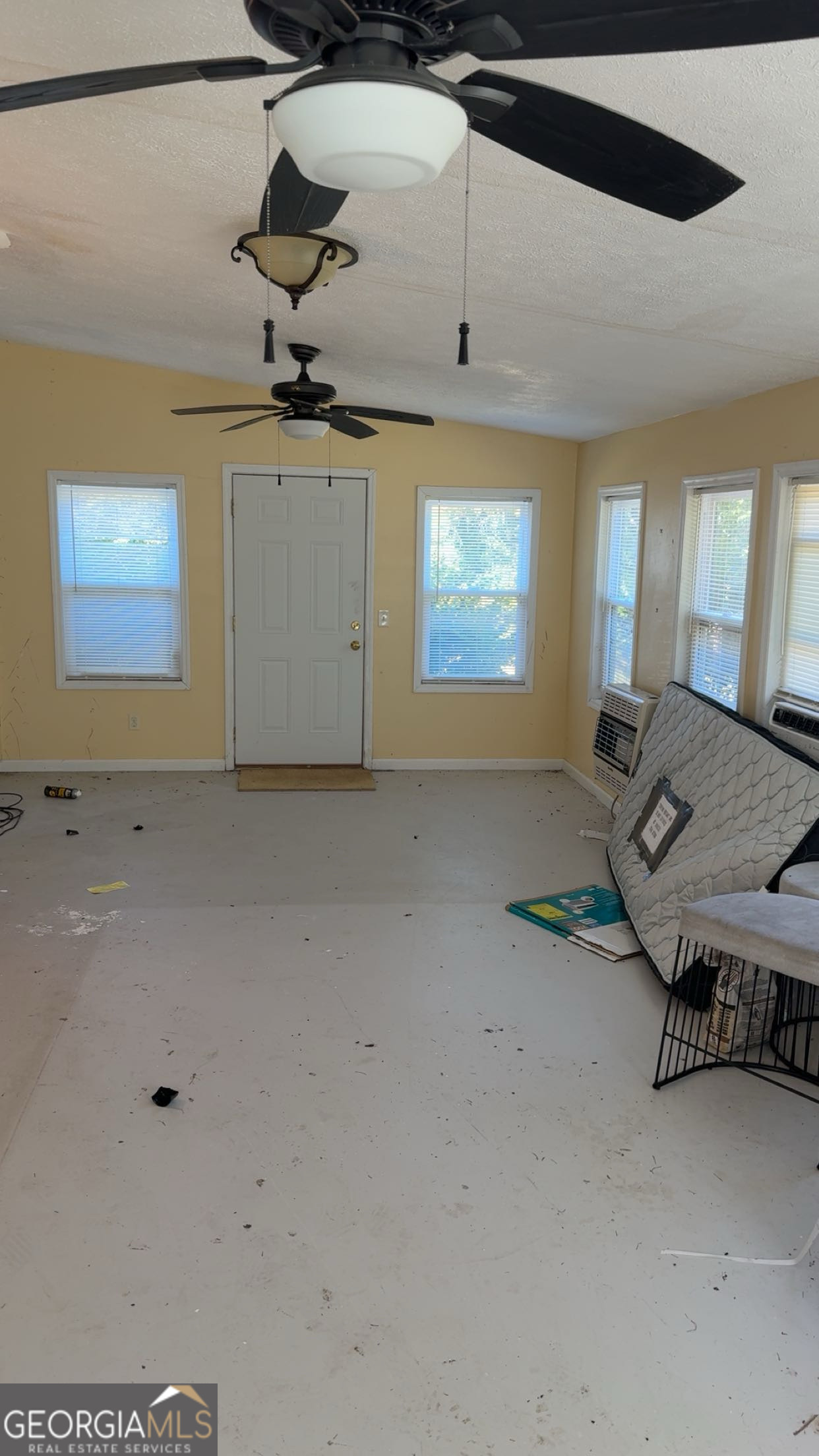 621 Highway 22 Sparta, GA 31087 - Photo 36 of 36 a view of livingroom and kitchen with furniture and ceiling fan