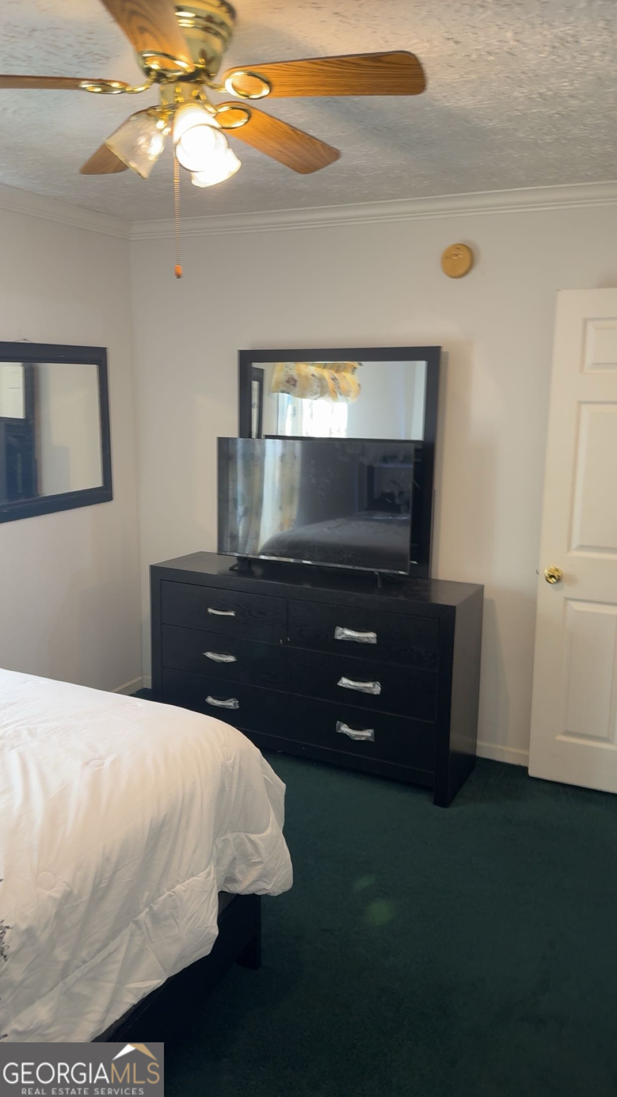 621 Highway 22 Sparta, GA 31087 - Photo 10 of 36 a bed room with a bed and a television