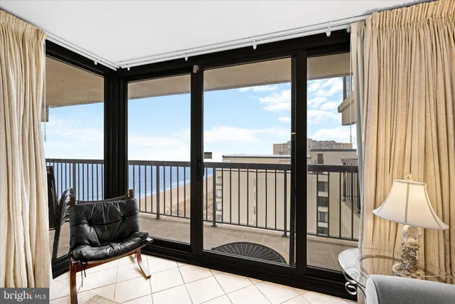 a living room with furniture and a dining table with wooden floor