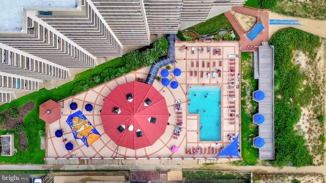 a view of a swimming pool with a yard