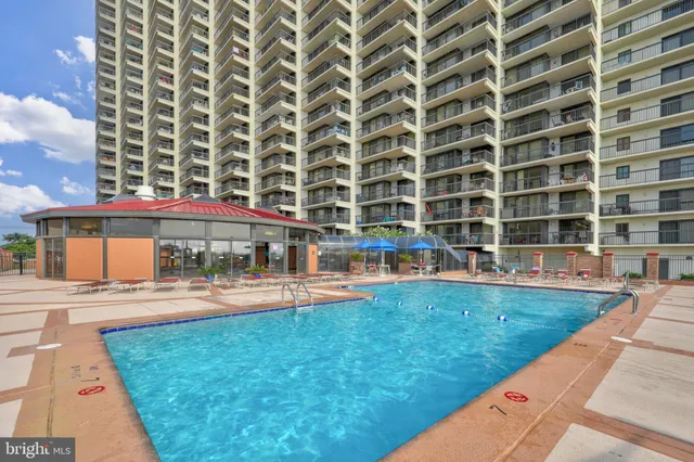 a view of a swimming pool with a lounge chairs