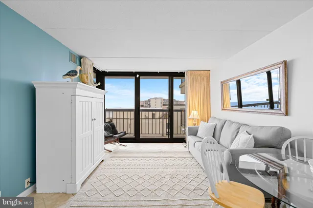 a view of a livingroom with furniture and a window