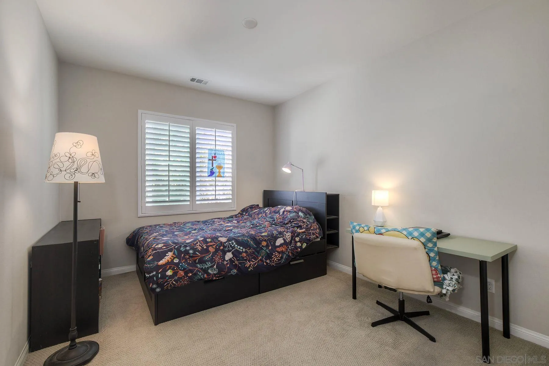 16482 Edgehill Road San Diego, CA 92127 - Photo 22 of 35 a bedroom with a bed and a table in it