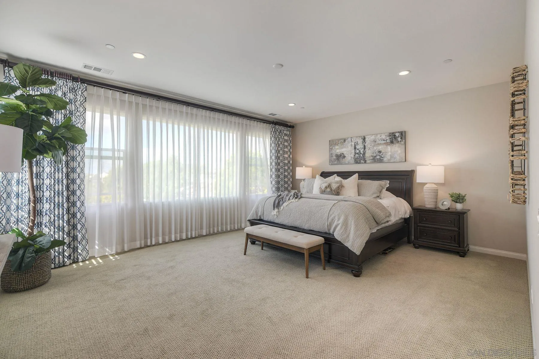 16482 Edgehill Road San Diego, CA 92127 - Photo 27 of 35 a spacious bedroom with a bed and a large window