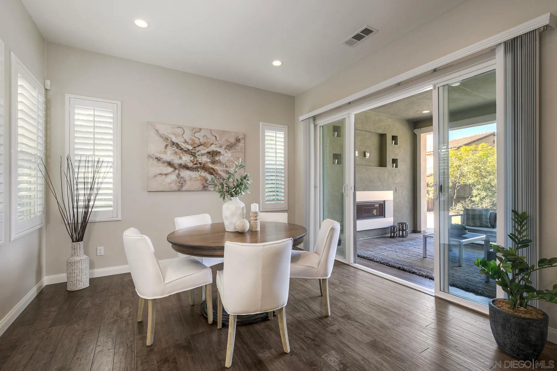 16482 Edgehill Road San Diego, CA 92127 - Photo 7 of 35 a dining room with furniture wooden floor and a potted plant