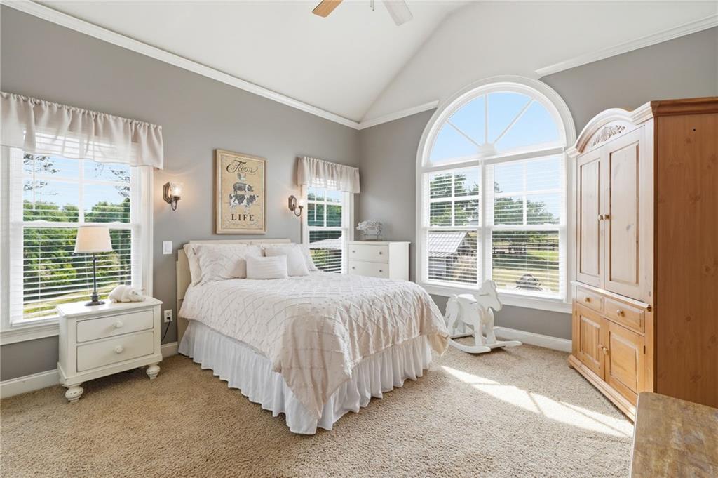 3535 Dr Bramblett Road Cumming, GA 30028 - Photo 50 of 91 a spacious bedroom with a bed and a window
