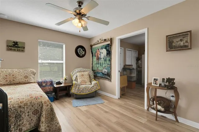 a bedroom with furniture and a window