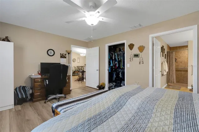 a view of a livingroom with workspace and a window