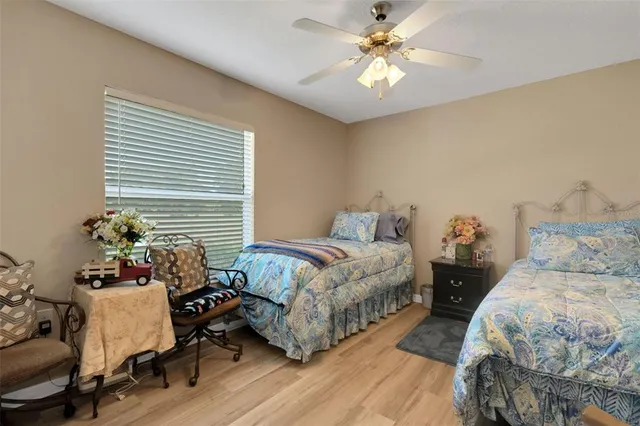 a bedroom with a bed and windows