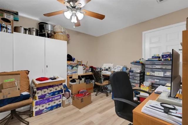 a bedroom with furniture and a book shelf