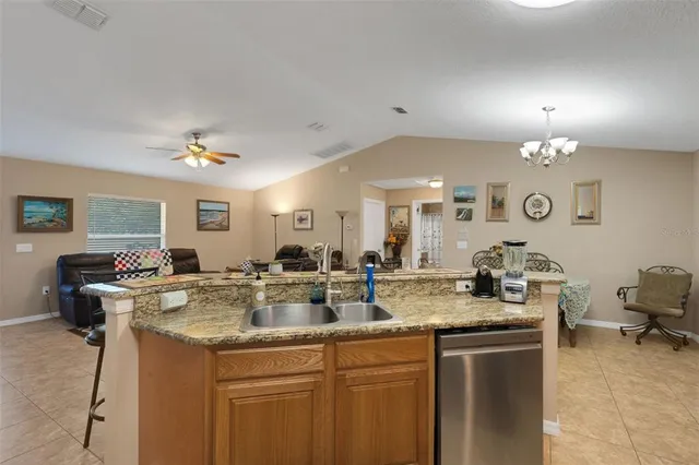 a view of a living room and kitchen