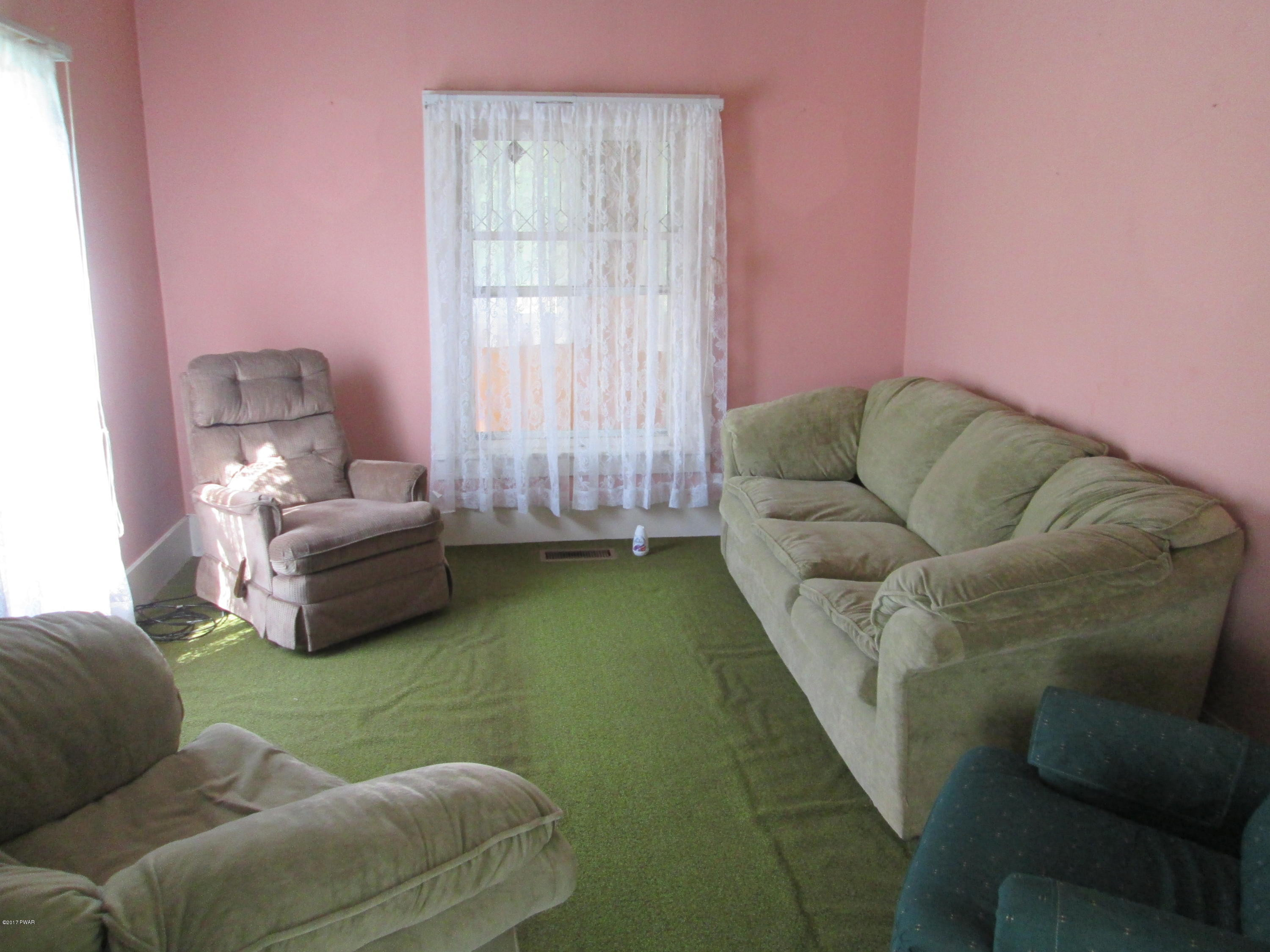 86 Beaver Hollow Road Lakewood, PA 18439 - Photo 7 of 30 a living room with furniture and a window