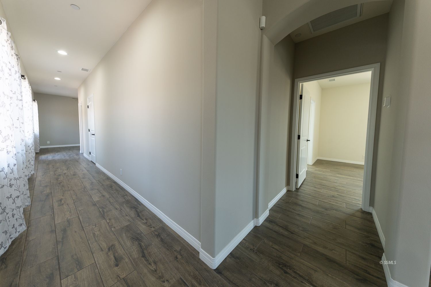 133 Rancho Del Cerro Ridgecrest, CA 93555 - Photo 25 of 50 a view of a hallway with wooden floor