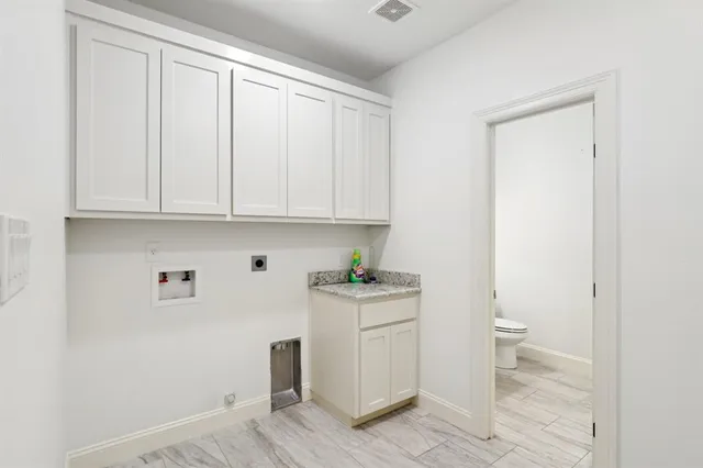 a view of cabinets and wooden floor
