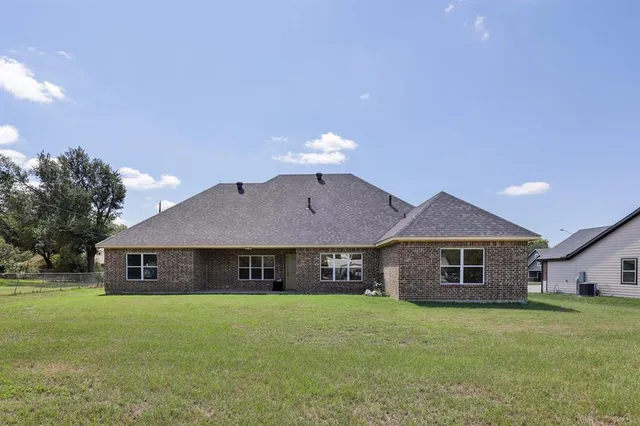 a front view of a house with a garden and porch