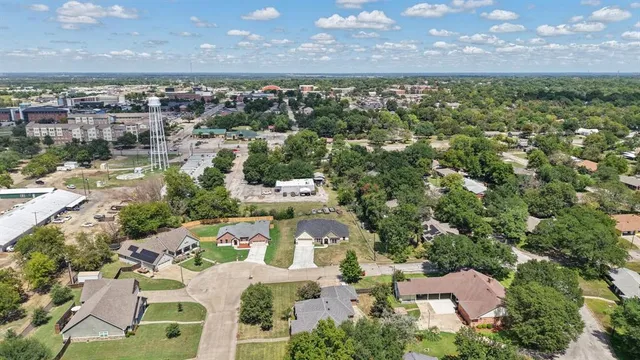 an aerial view of a house with a lake view