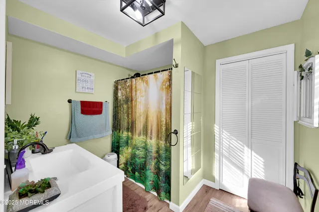 a bathroom with a tub and shower