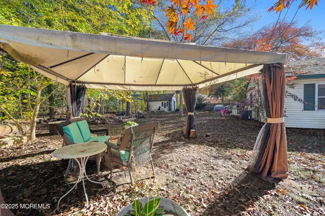 a view of yard with patio