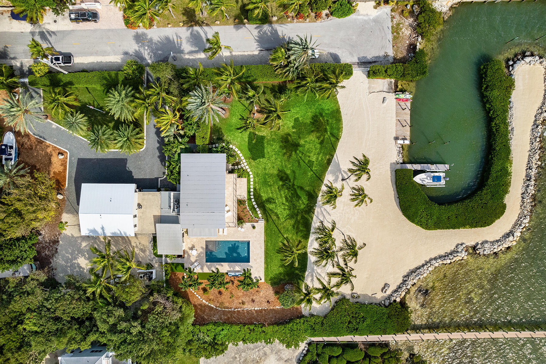 an aerial view of a house with outdoor space pool seating area and yard