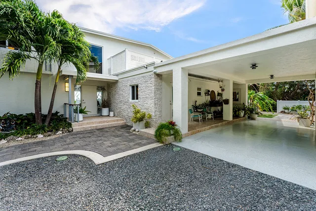 a view of a house with a yard porch and sitting area