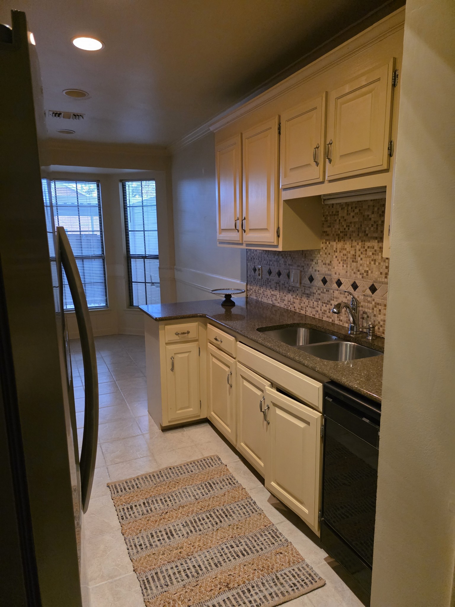 421 General George Patton Road Nashville, TN 37221 - Photo 13 of 33 a kitchen with a sink stove and cabinets