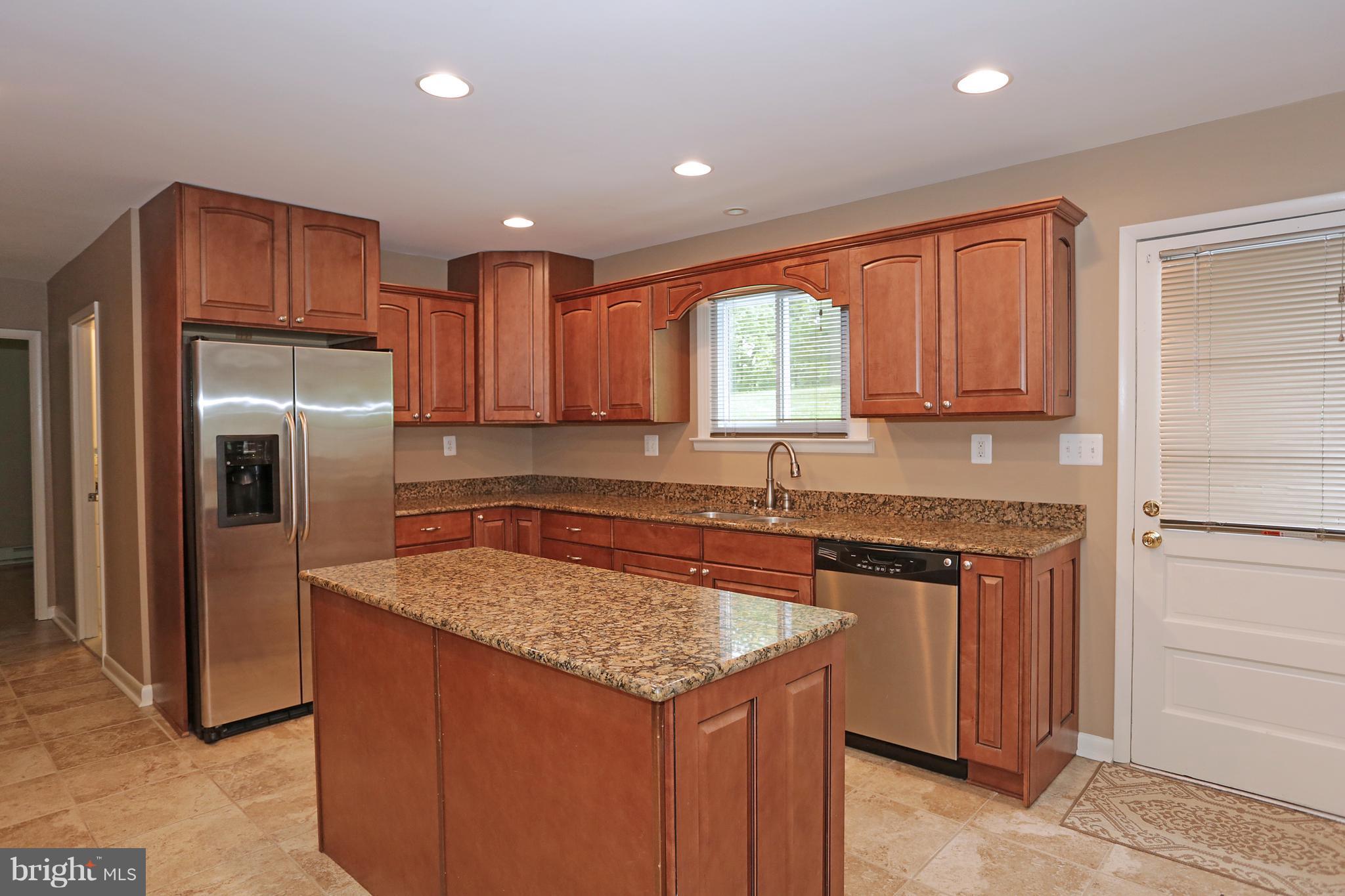 1213 Watervale Road Fallston, MD 21047 - Photo 13 of 30 a kitchen with stainless steel appliances granite countertop a refrigerator a sink a stove a microwave and island