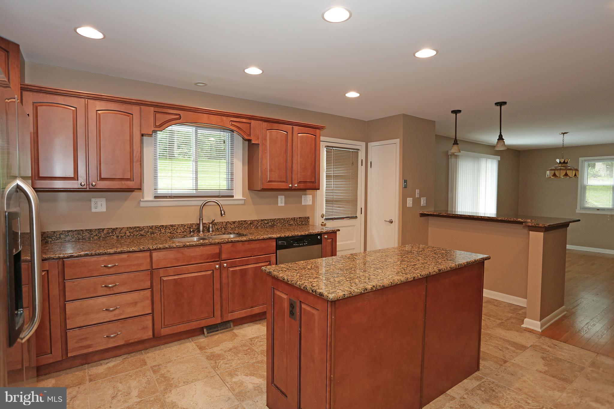 1213 Watervale Road Fallston, MD 21047 - Photo 15 of 30 a kitchen with a granite countertop sink window and cabinets