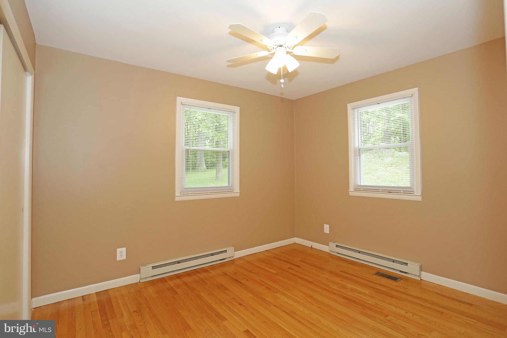 1213 Watervale Road Fallston, MD 21047 - Photo 18 of 30 an empty room with wooden floor and windows