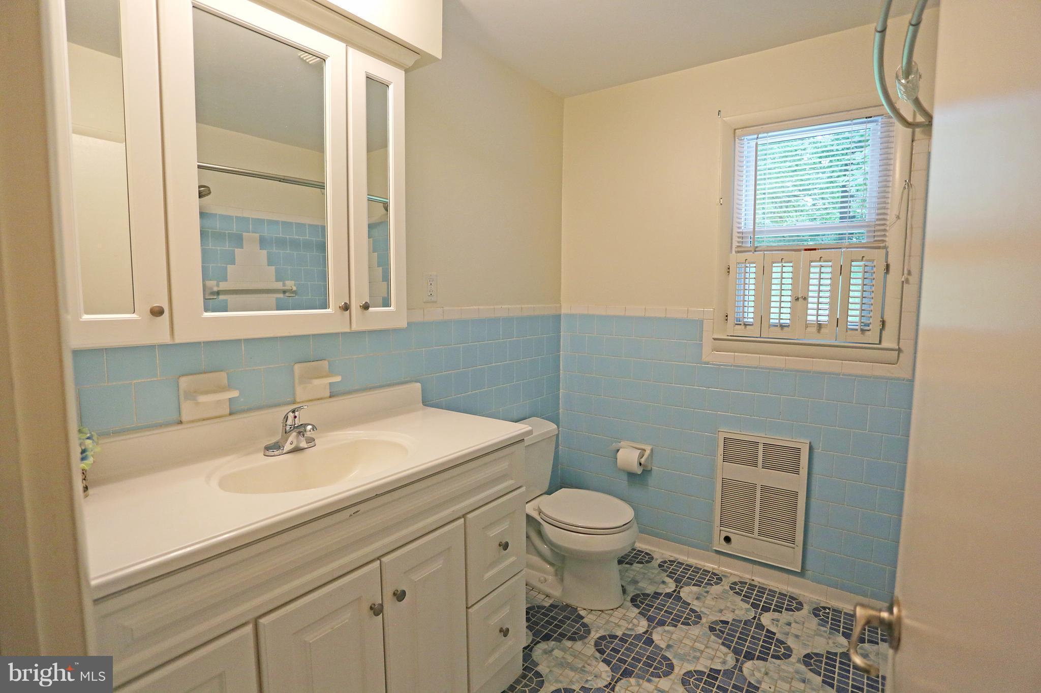 1213 Watervale Road Fallston, MD 21047 - Photo 23 of 30 a bathroom with a sink a toilet and a window