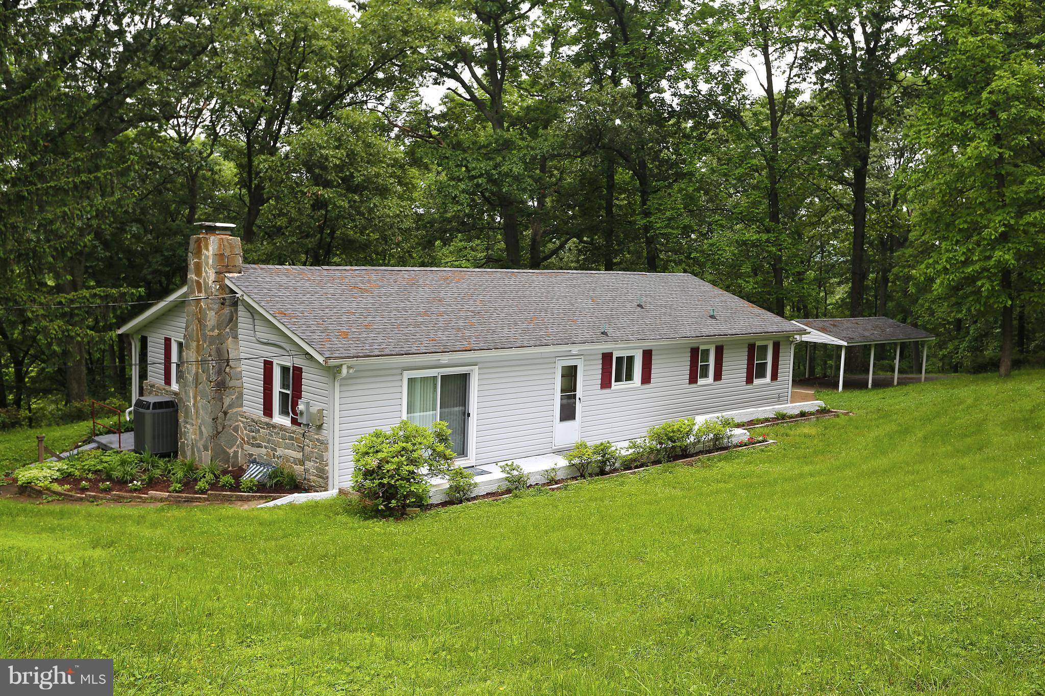 1213 Watervale Road Fallston, MD 21047 - Photo 4 of 30 a front view of a house with a garden