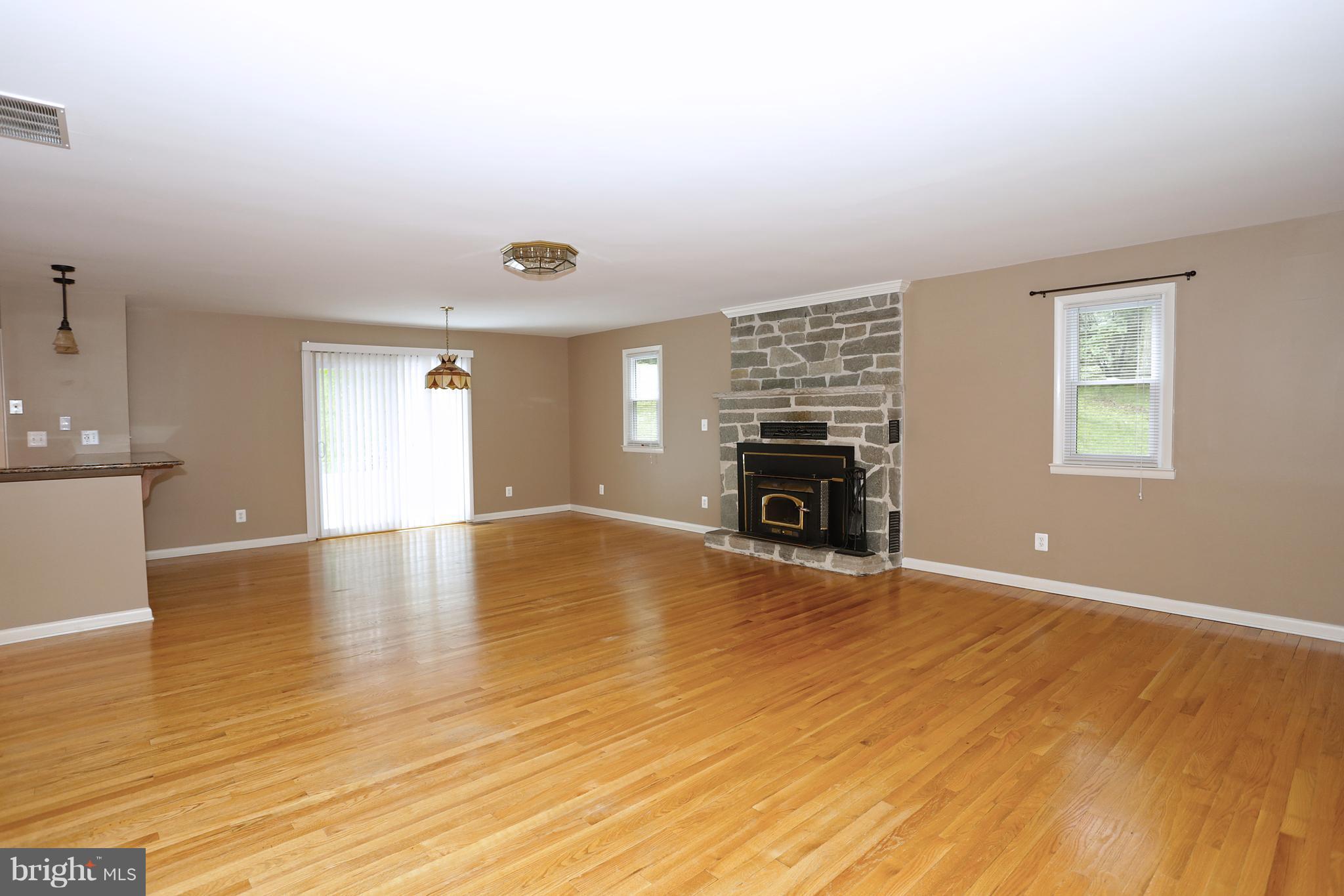 1213 Watervale Road Fallston, MD 21047 - Photo 8 of 30 a view of empty room with fireplace and wooden floor