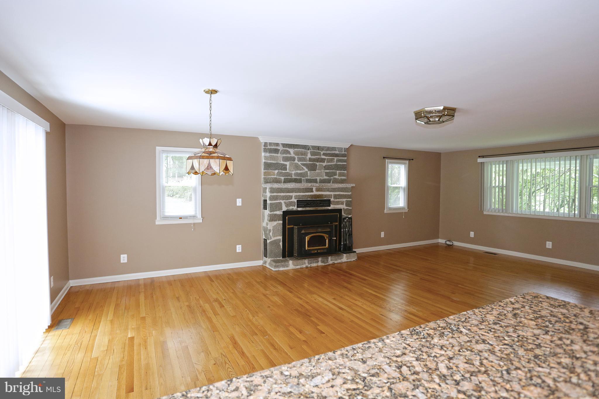 1213 Watervale Road Fallston, MD 21047 - Photo 9 of 30 a view of empty room with fireplace and windows
